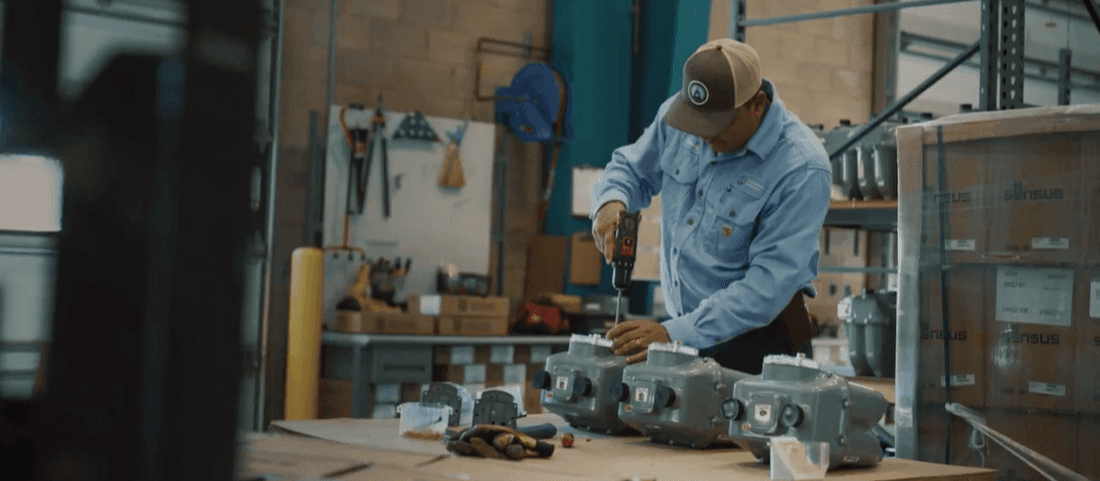 Natural Gas employee working on a meter in a warehouse